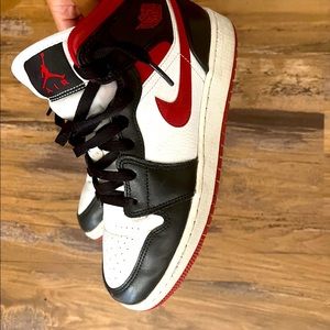 red and black nike jordan 1s (mids)